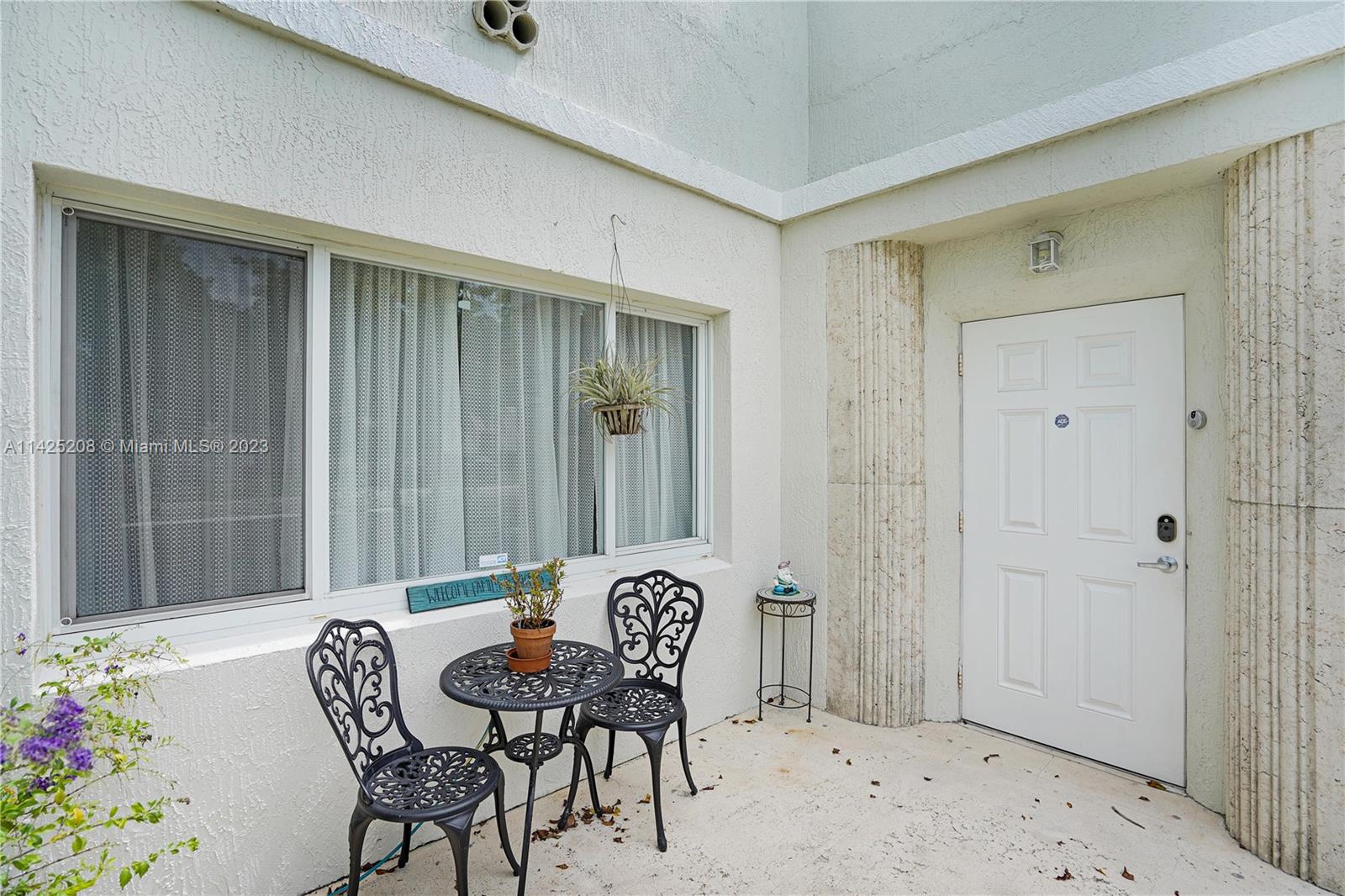 2235 Southwest 11th Terrace Miami, FL 33135 - Photo 13 of 43 a view of a dining room with furniture and chandelier