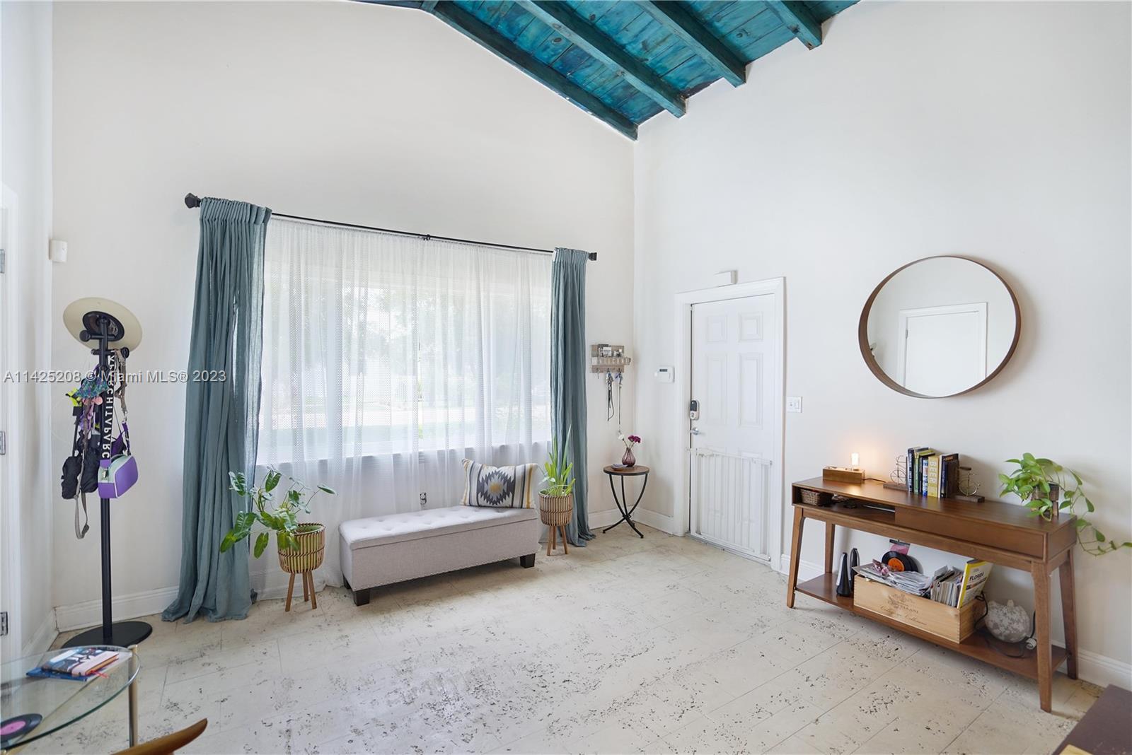 2235 Southwest 11th Terrace Miami, FL 33135 - Photo 14 of 43 a living room with furniture a window and a chandelier