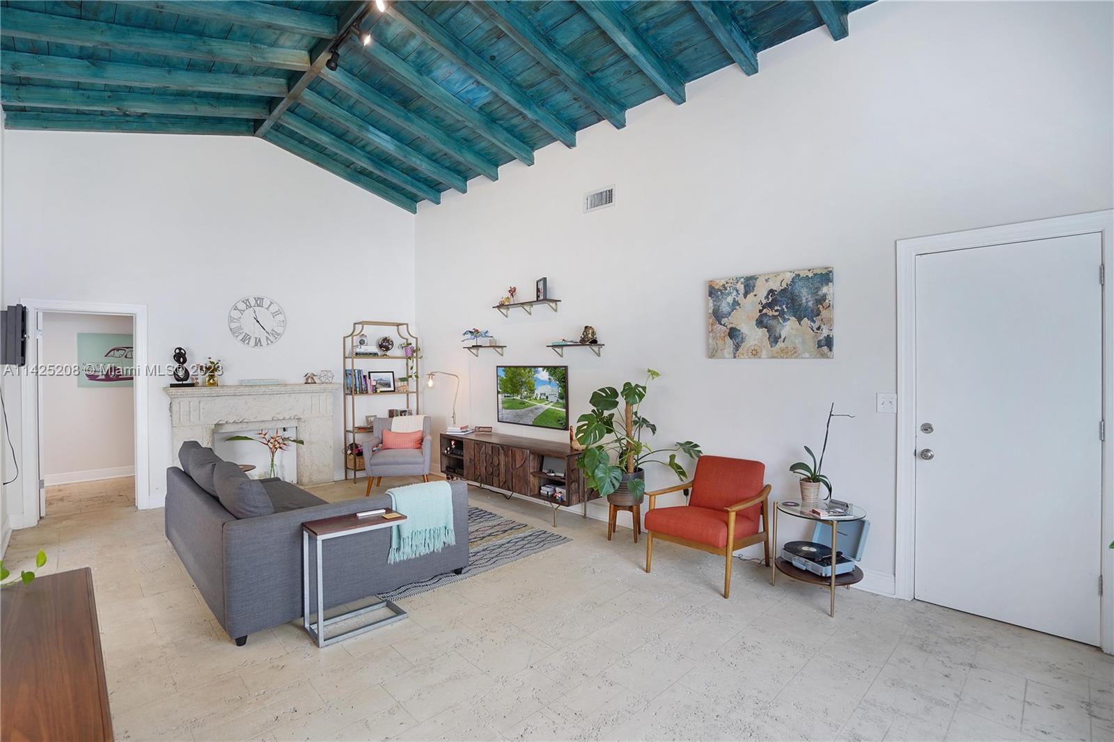 2235 Southwest 11th Terrace Miami, FL 33135 - Photo 15 of 43 a living room with furniture and a chandelier