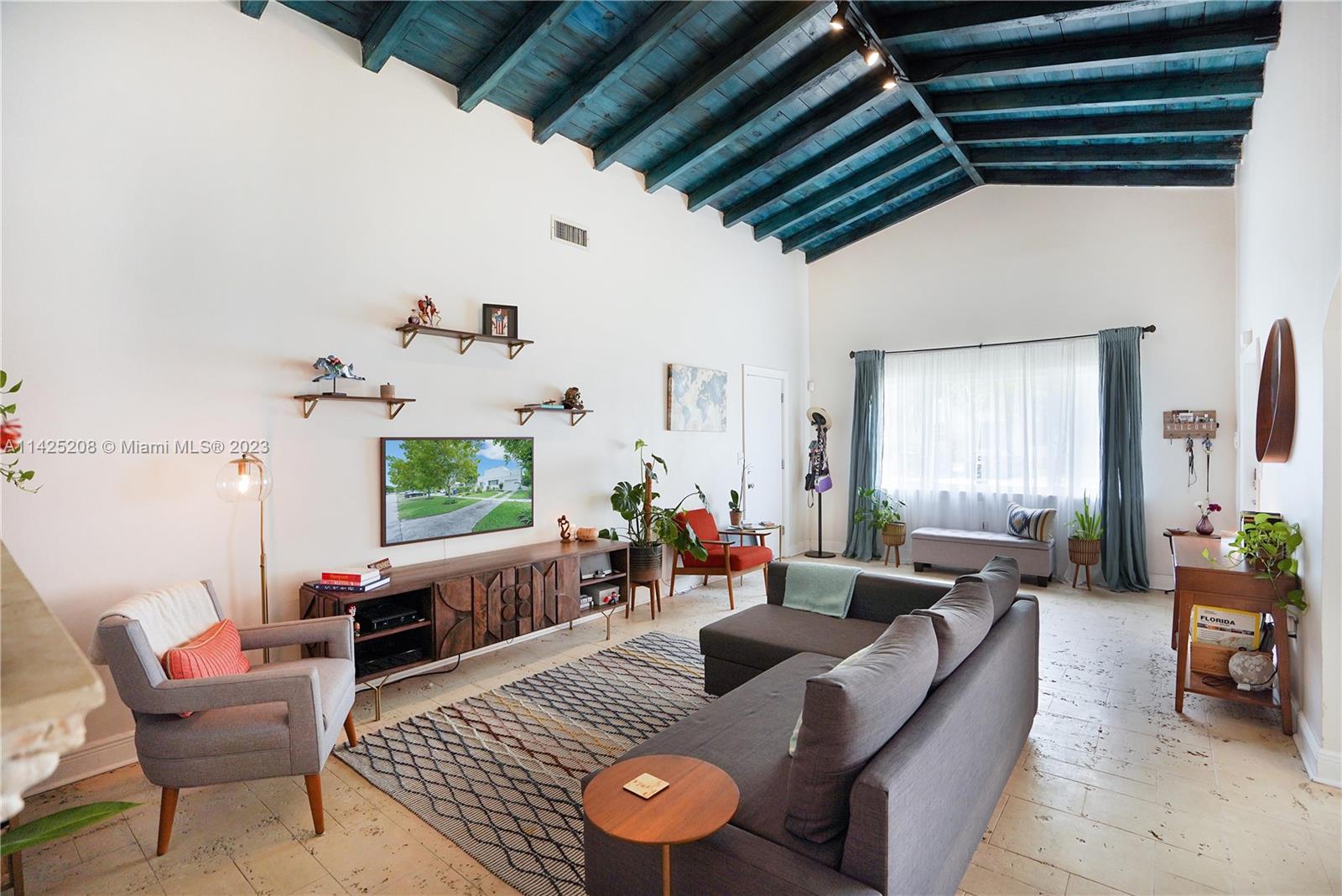 2235 Southwest 11th Terrace Miami, FL 33135 - Photo 17 of 43 a living room with furniture and a large window