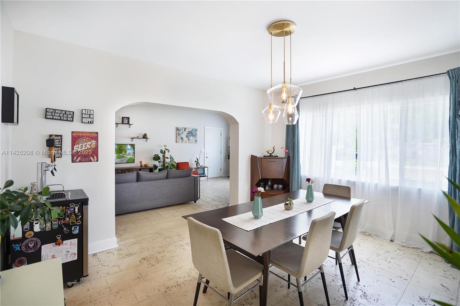 2235 Southwest 11th Terrace Miami, FL 33135 - Photo 19 of 43 a view of a dining room with furniture and a chandelier