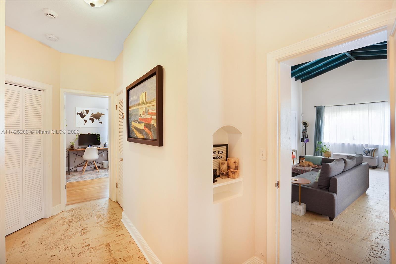 2235 Southwest 11th Terrace Miami, FL 33135 - Photo 26 of 43 a living room with furniture and a refrigerator