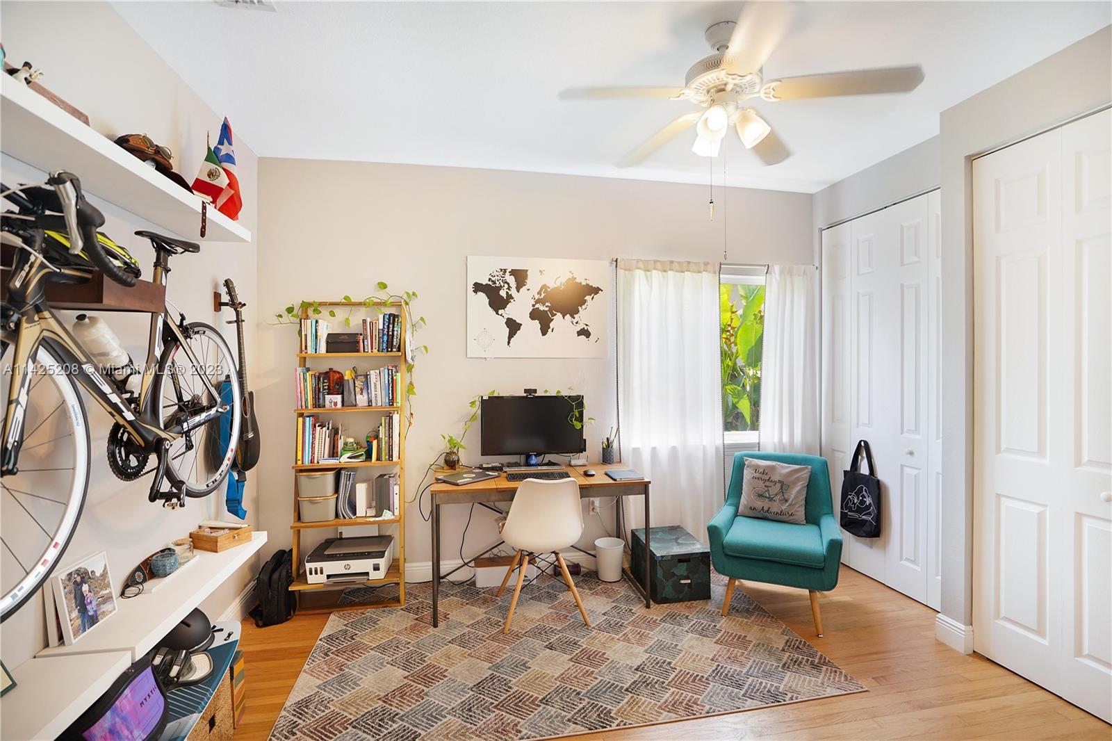 2235 Southwest 11th Terrace Miami, FL 33135 - Photo 27 of 43 a view of a workspace with furniture and a window