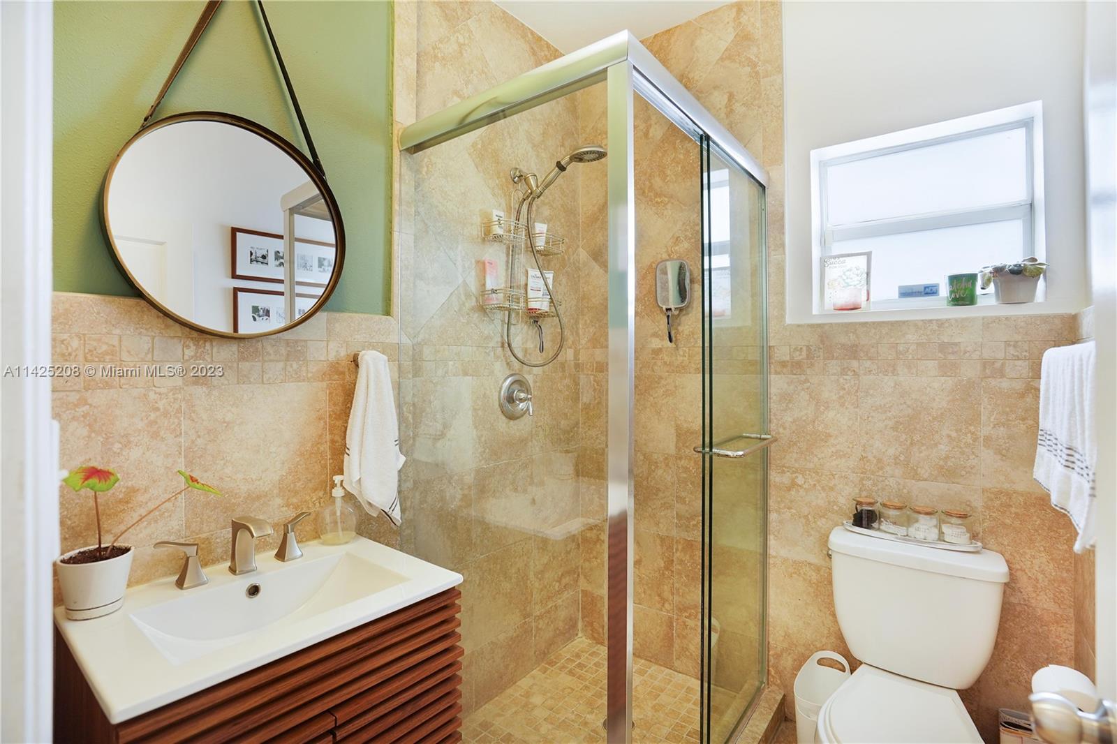 2235 Southwest 11th Terrace Miami, FL 33135 - Photo 29 of 43 a bathroom with a sink toilet and shower