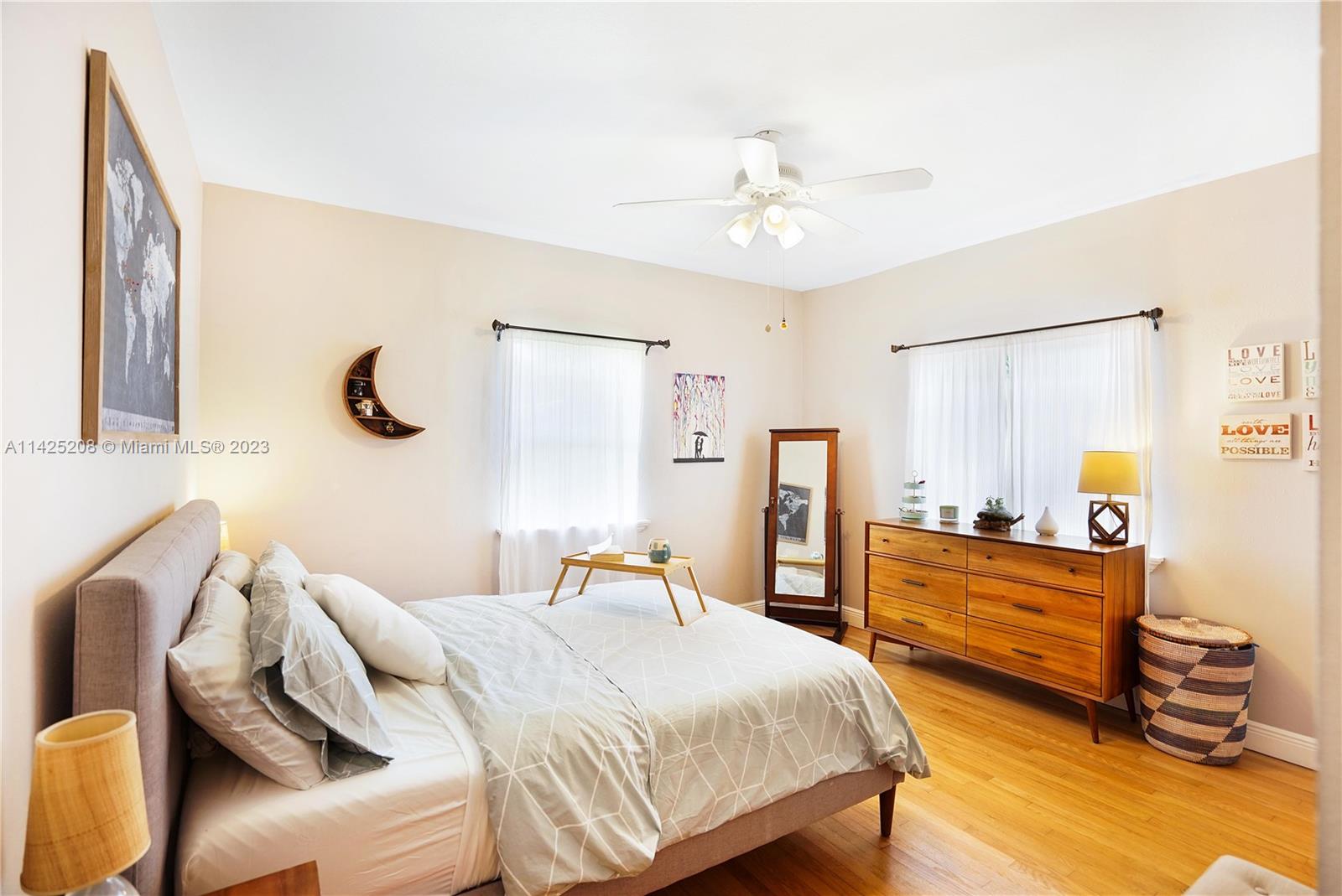 2235 Southwest 11th Terrace Miami, FL 33135 - Photo 32 of 43 a bedroom with a bed and wooden floor