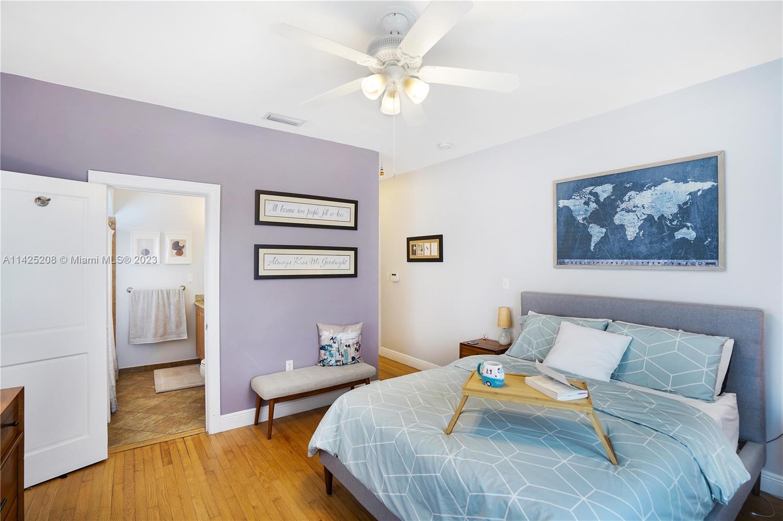 2235 Southwest 11th Terrace Miami, FL 33135 - Photo 34 of 43 a bedroom with furniture and a wooden floor