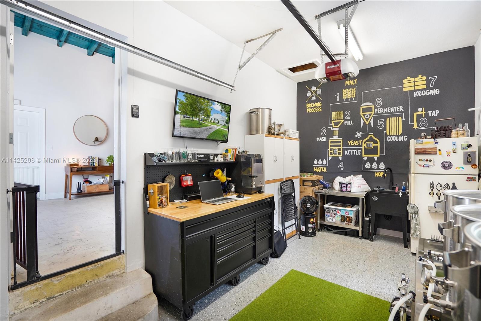 2235 Southwest 11th Terrace Miami, FL 33135 - Photo 36 of 43 a kitchen with a refrigerator and a stove top oven