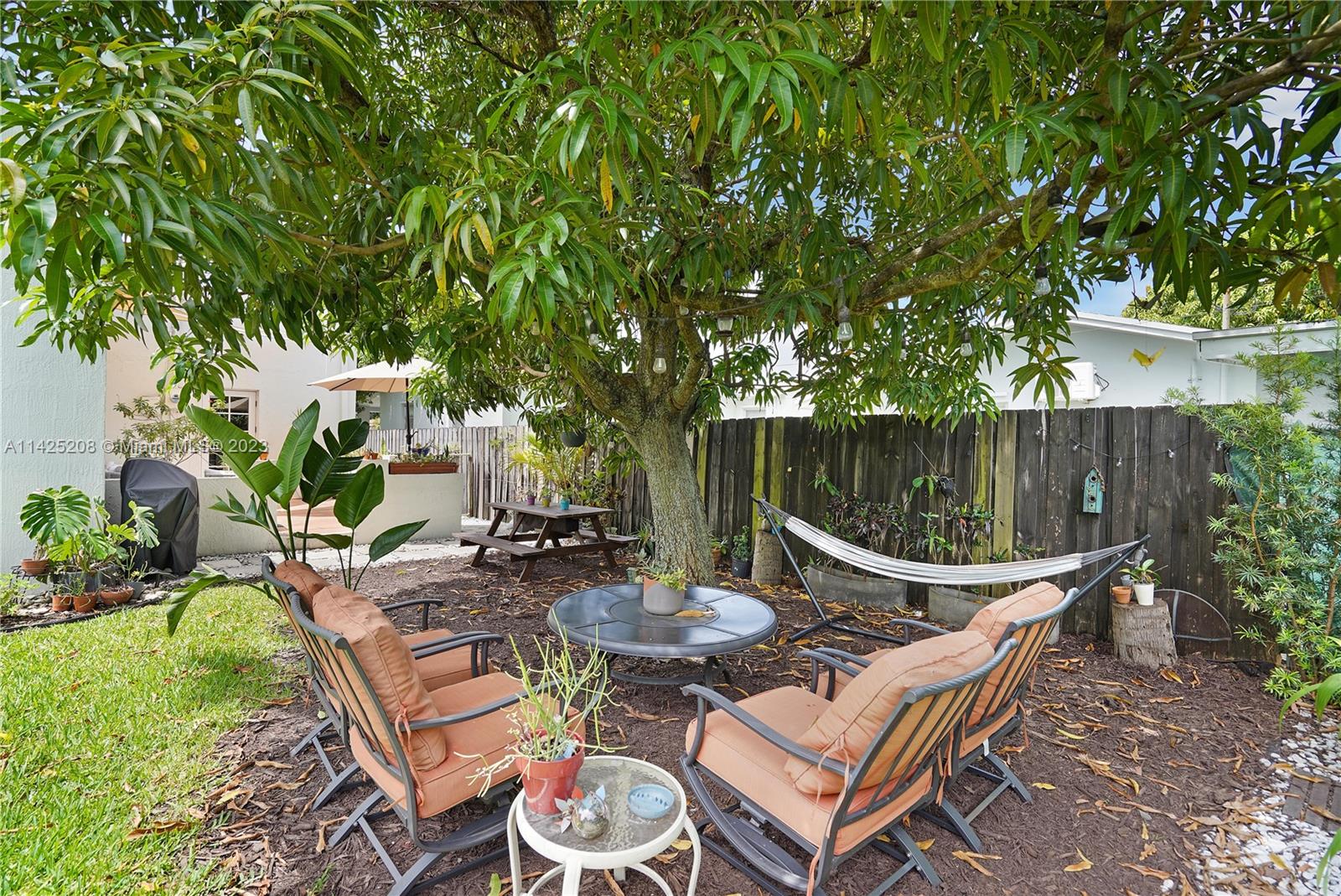 2235 Southwest 11th Terrace Miami, FL 33135 - Photo 43 of 43 a view of a backyard with furniture and a garden