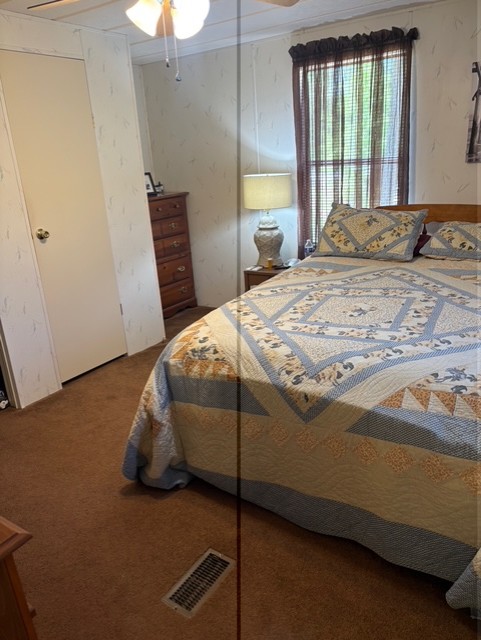 18 Tarheel Lane Iva, SC 29655 - Photo 11 of 17 This cozy bedroom offers a tranquil retreat with ample natural light.