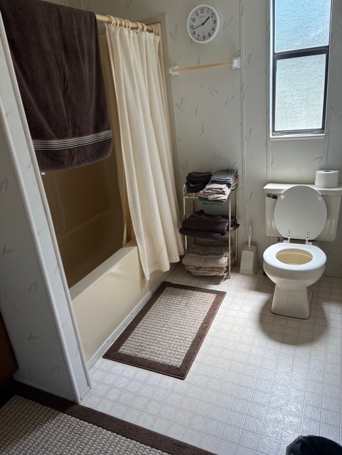 18 Tarheel Lane Iva, SC 29655 - Photo 13 of 17 This functional bathroom features practical flooring and ample natural light, ensuring everyday comfort and utility.