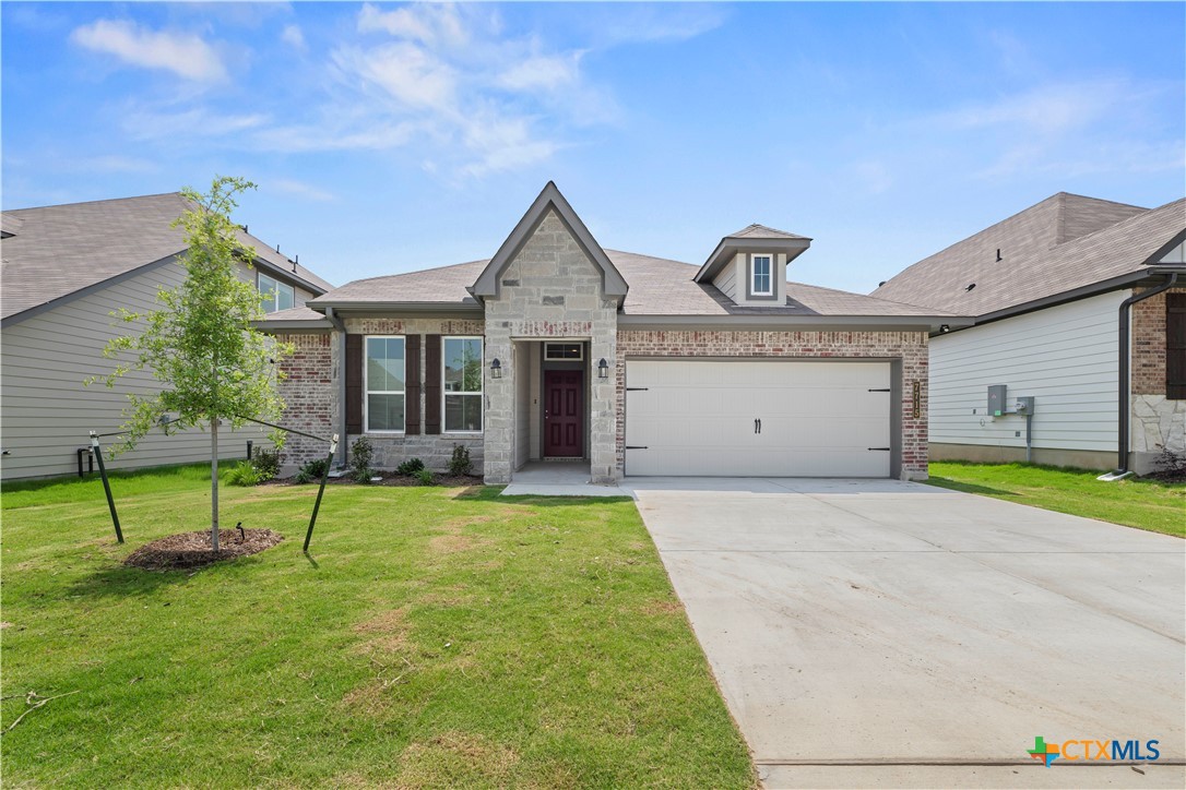 7715 Krenek Tap Drive Temple, TX 76502 - Photo 1 of 30 a view of an house with backyard space and a tree
