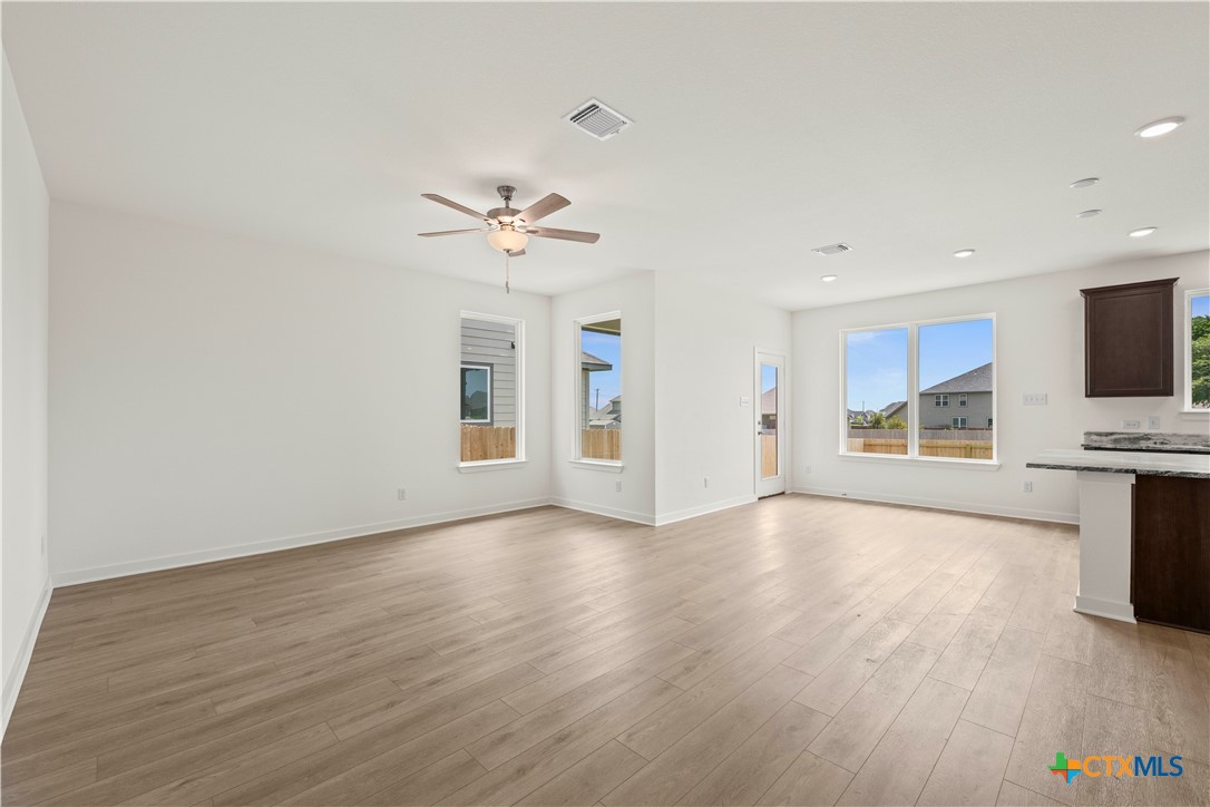 7715 Krenek Tap Drive Temple, TX 76502 - Photo 21 of 30 a view of an empty room with a window and wooden floor