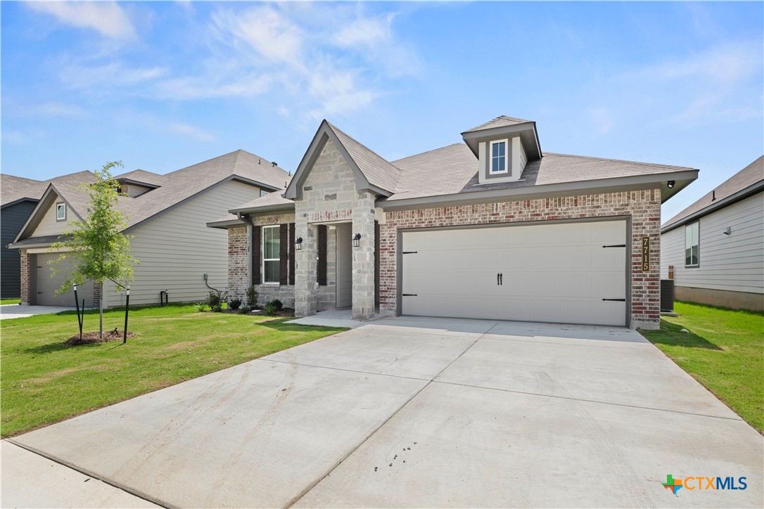 7715 Krenek Tap Drive Temple, TX 76502 - Photo 3 of 30 a front view of a house with a yard and garage