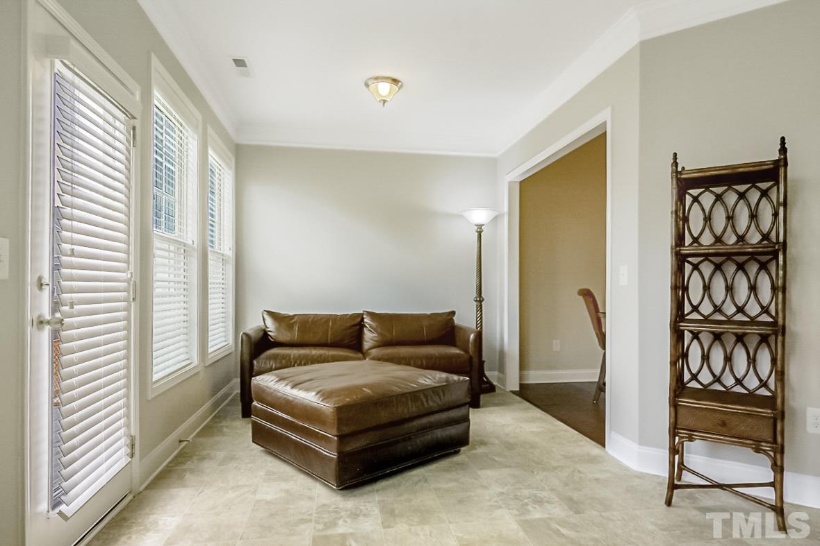 7617 Channery Way Raleigh, NC 27616 - Photo 18 of 42 a bedroom with a bed and a couch