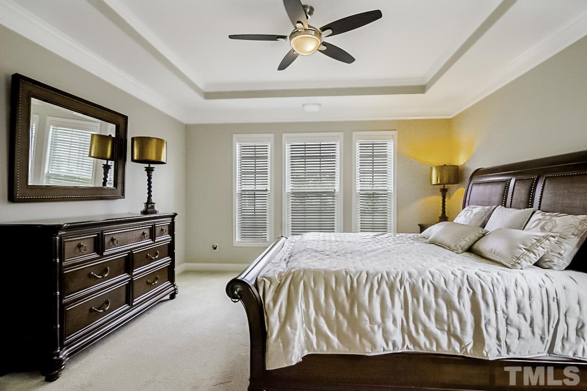 7617 Channery Way Raleigh, NC 27616 - Photo 20 of 42 a bedroom with a bed and a window
