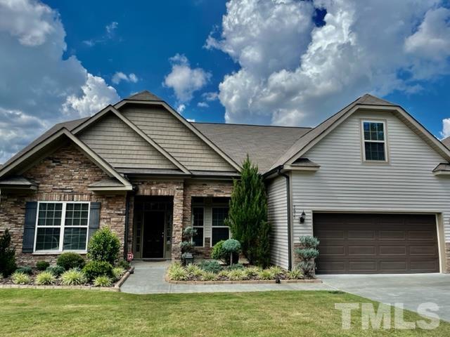 7617 Channery Way Raleigh, NC 27616 - Photo 2 of 42 a view of a house with swimming pool and a yard
