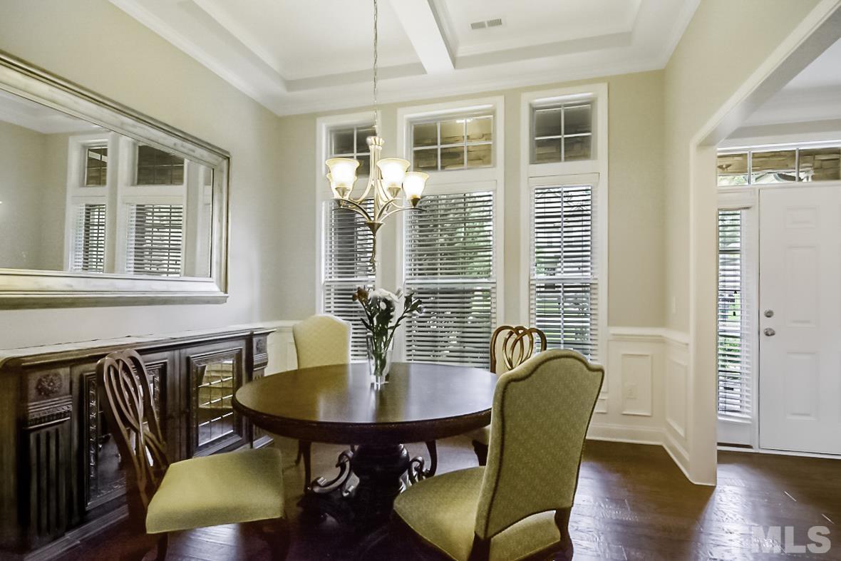 7617 Channery Way Raleigh, NC 27616 - Photo 7 of 42 a view of a dining room with furniture window and wooden floor