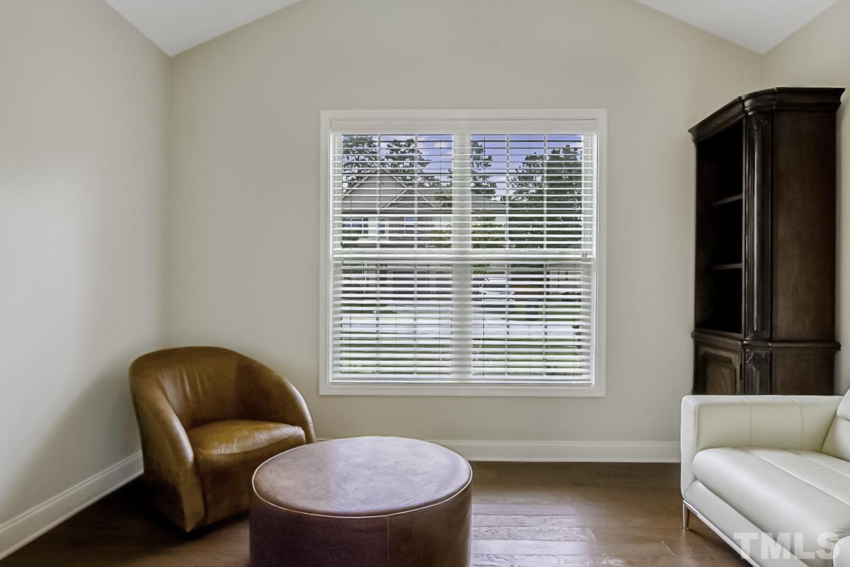 7617 Channery Way Raleigh, NC 27616 - Photo 9 of 42 a blue chair sitting in front of a window