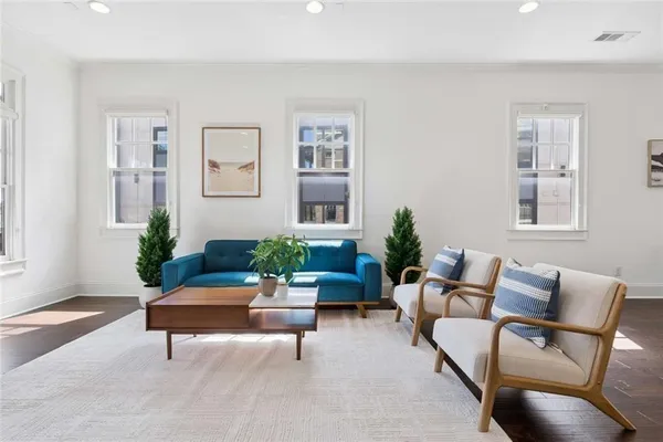 a living room with furniture and windows