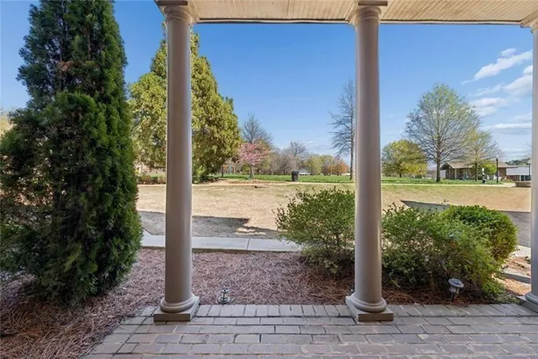 a view of a chair and tables in the patio