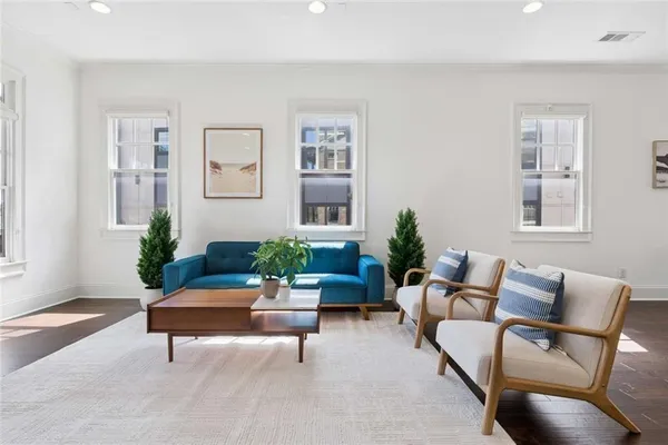 a front view of a building with a garden