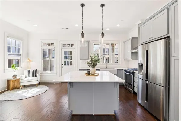 a living room with furniture and a lamp
