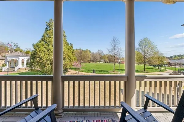 a view of a lake with couches and chairs