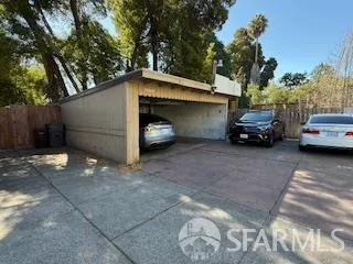 a view of a cars parked in back of a house