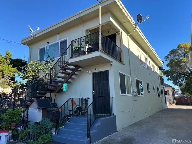 a view of a house with a small yard