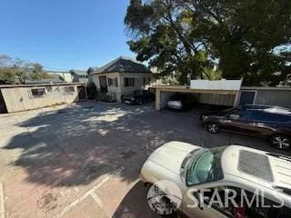 a view of a patio with furniture and a yard