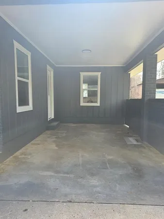 an empty room with windows