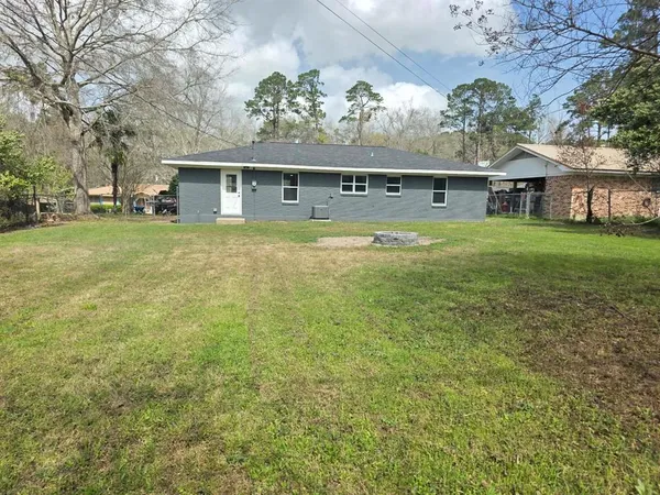 a front view of house with yard and seating