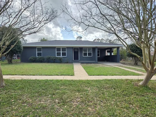 a view of house with a swimming pool