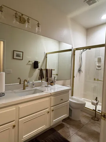 a view of a chairs and table in patio