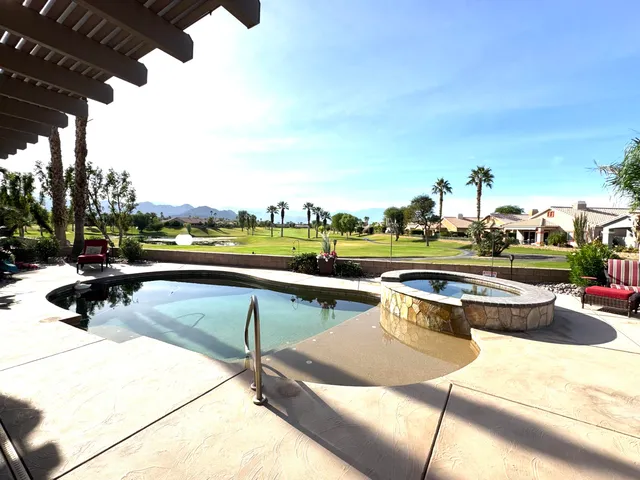 a view of a chairs and tables in the patio
