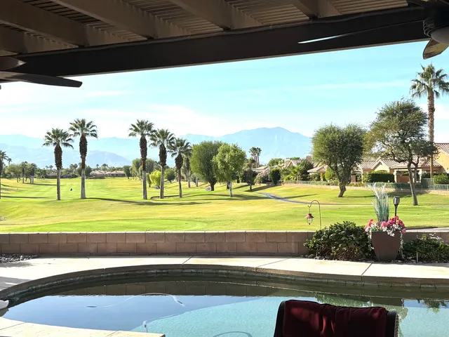 a view of a swimming pool with an ocean view