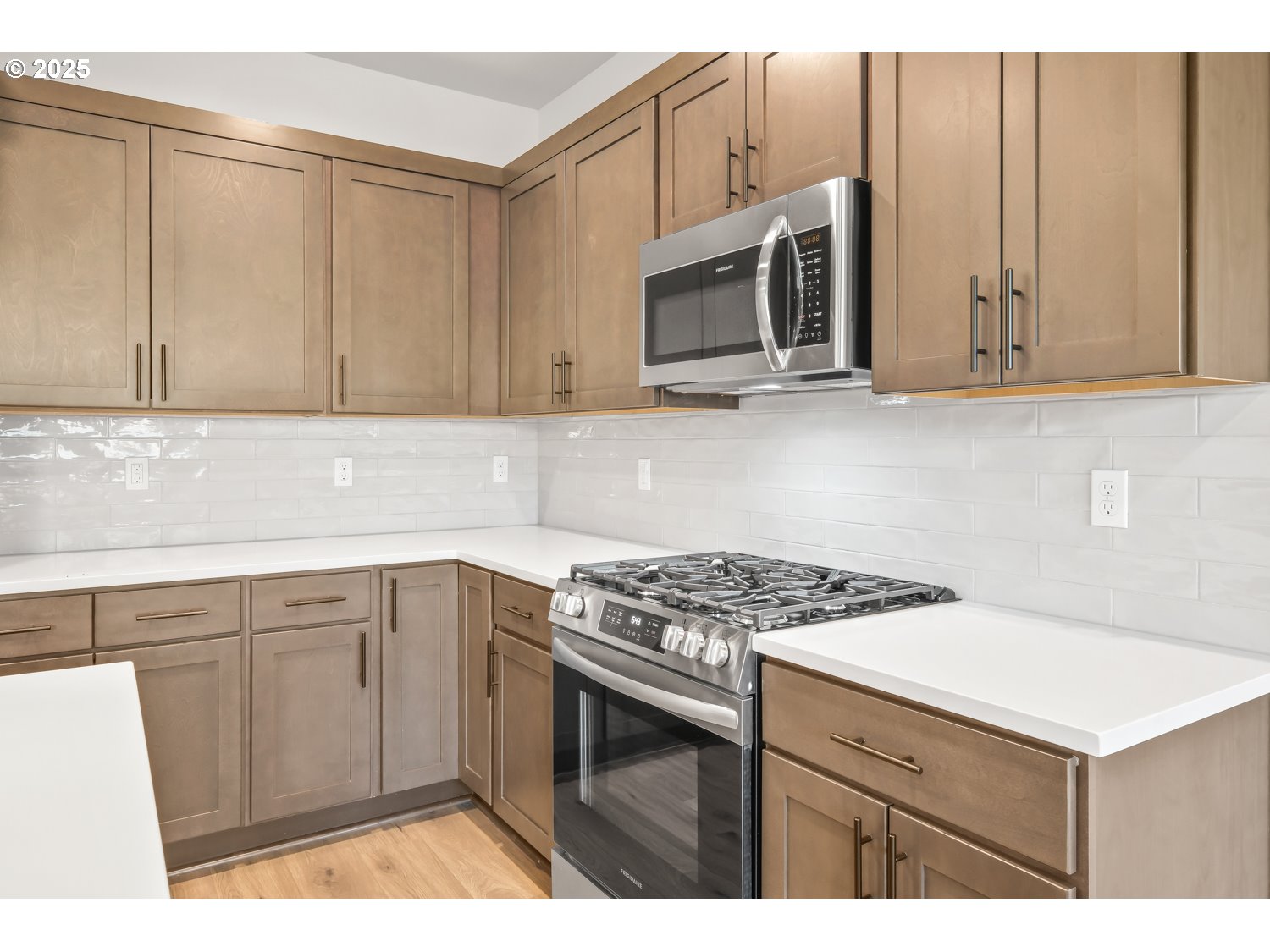 41900 Deschutes Avenue, Unit 81B Sandy, OR 97055 - Photo 5 of 33 a kitchen with stainless steel appliances white cabinets and a stove top oven
