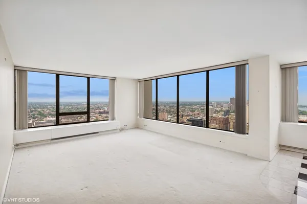 a view of an empty room with a large window