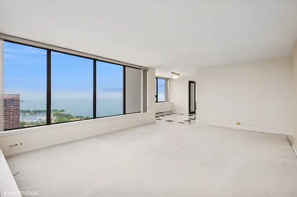 a view of an empty room with a large window