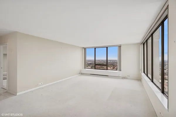 a view of an empty room with a window