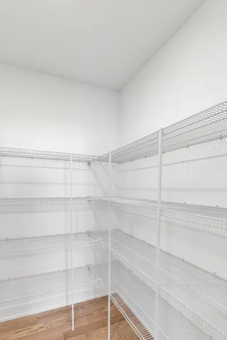 a view of a room with shelf on the wall