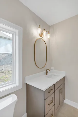 a bathroom with a sink and a mirror