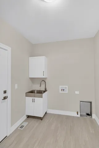 a kitchen with a sink and cabinets