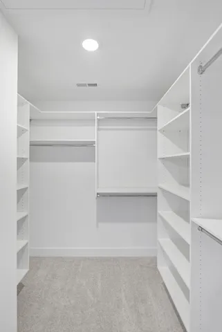 a view of an empty walk in closet