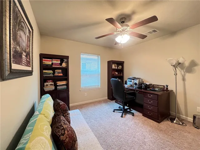 a bedroom with furniture and a window