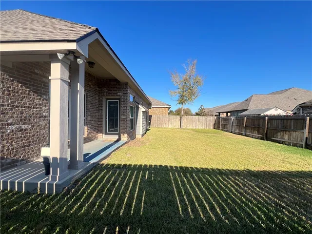 a view of swimming pool with seating space