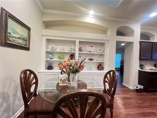 a dining room with furniture and window