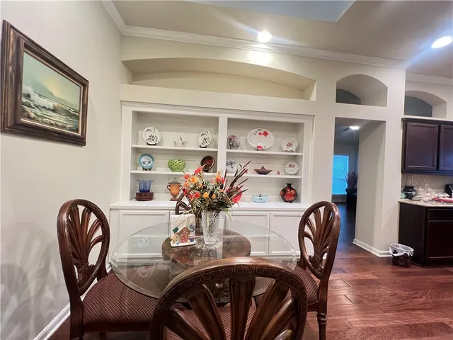 a dining room with furniture and window