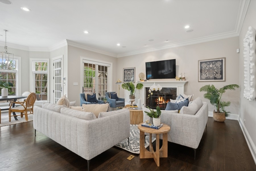 2 Bristol Road Northfield, IL 60093 - Photo 11 of 52 a living room with fireplace furniture and a flat screen tv