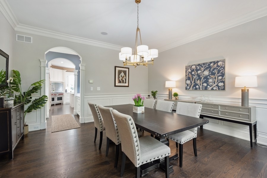 2 Bristol Road Northfield, IL 60093 - Photo 14 of 52 a view of a dining room with furniture and wooden floor